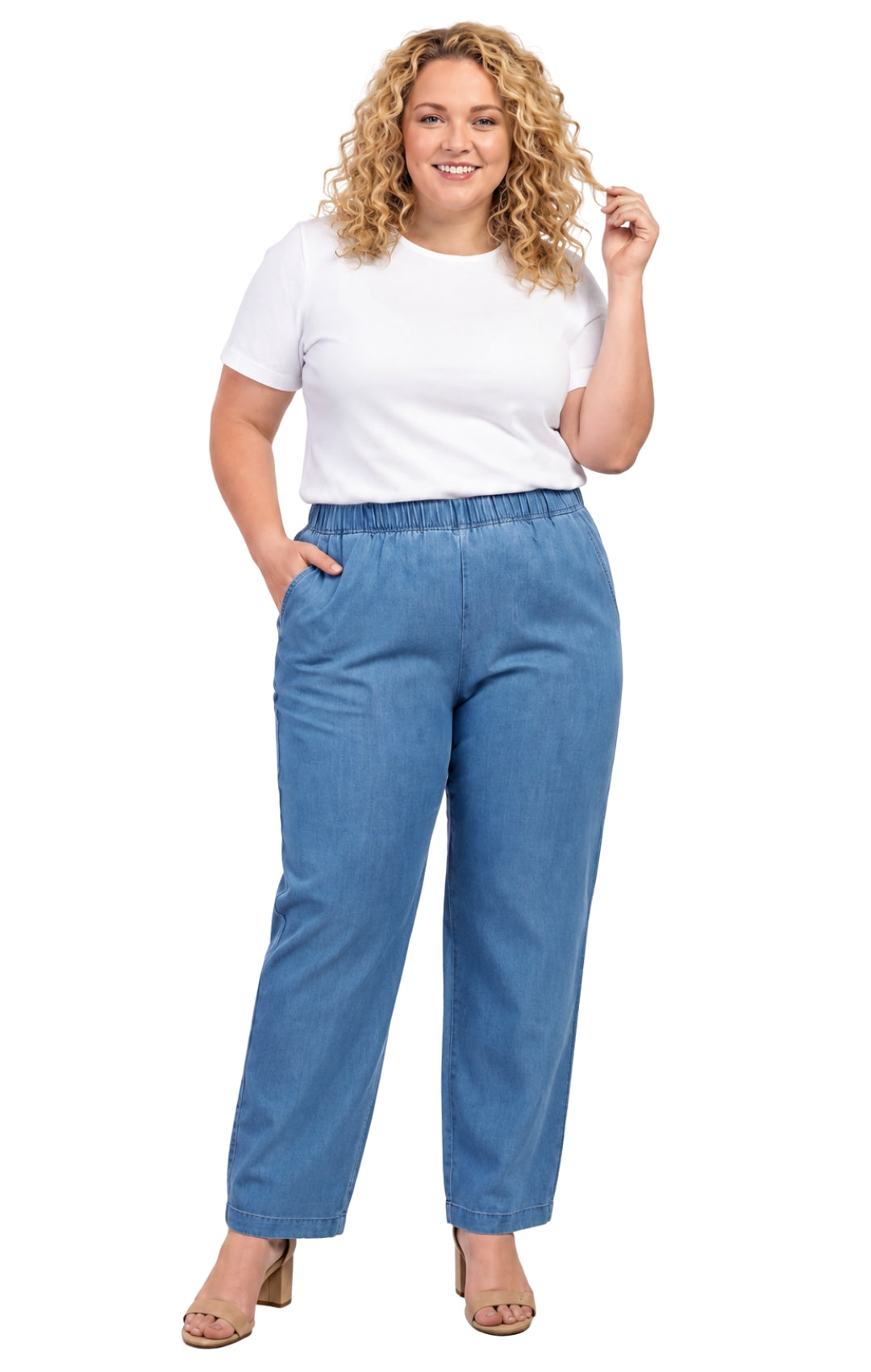 Woman wearing a white t-shirt and blue jeans on a white background