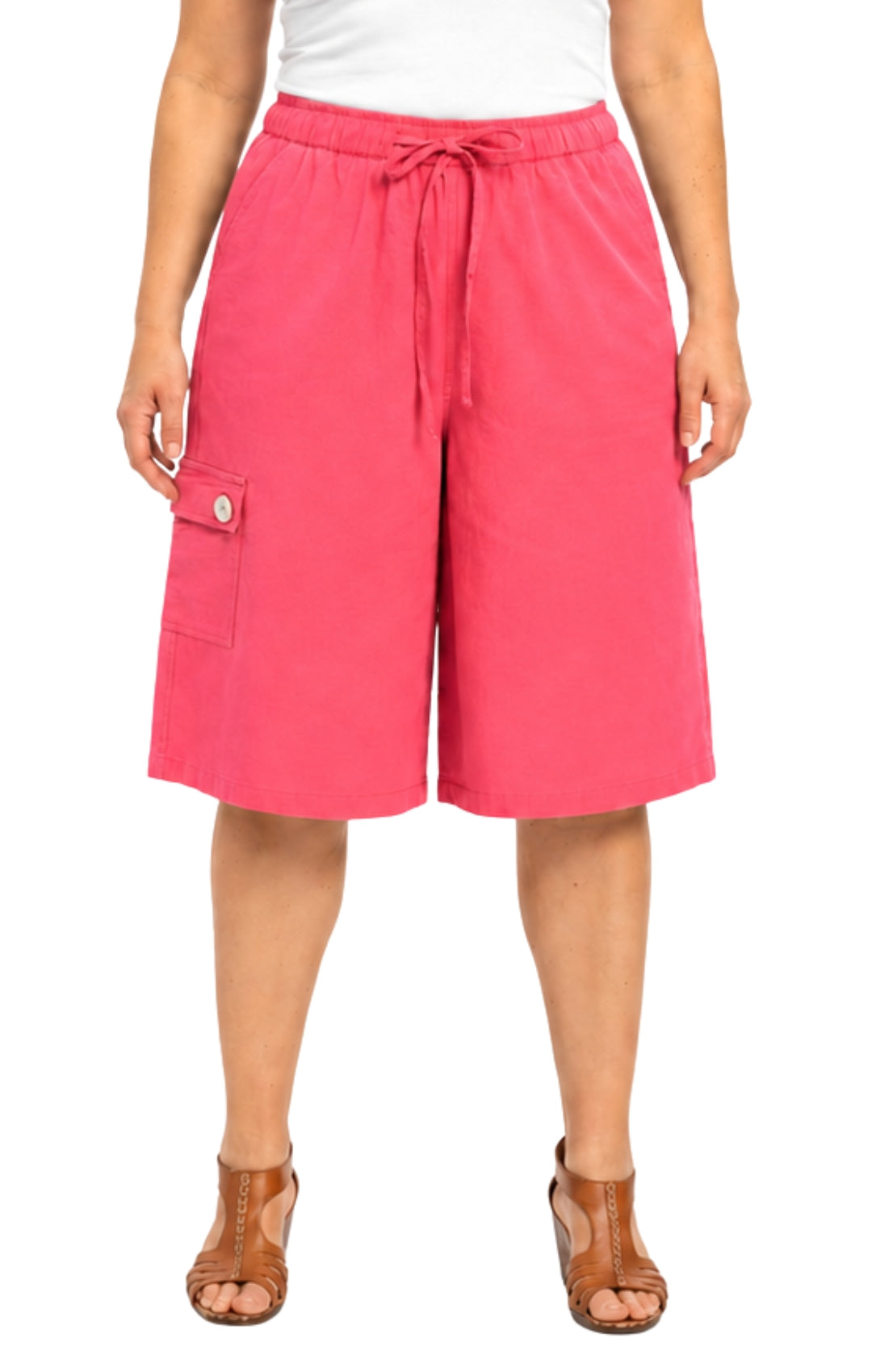 Person wearing bright pink shorts on a white background