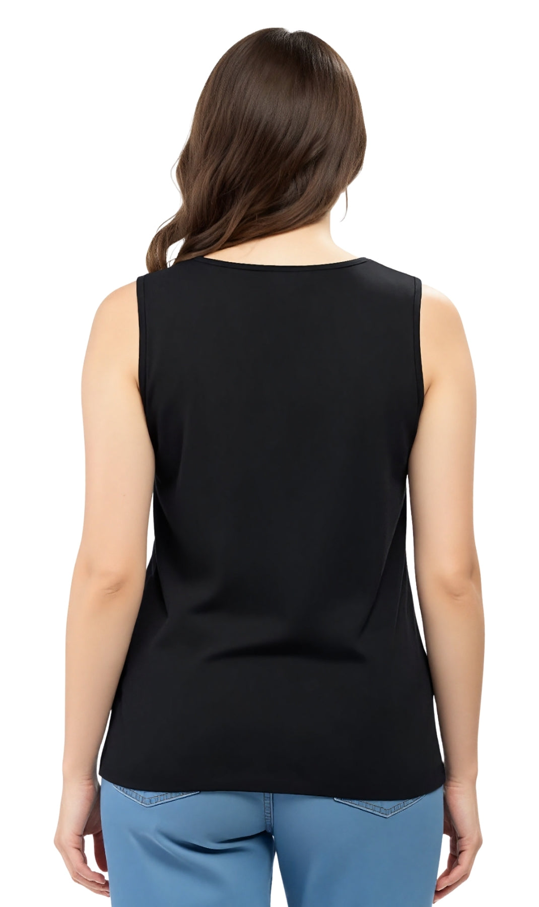Woman wearing a black sleeveless top and blue pants on a white background