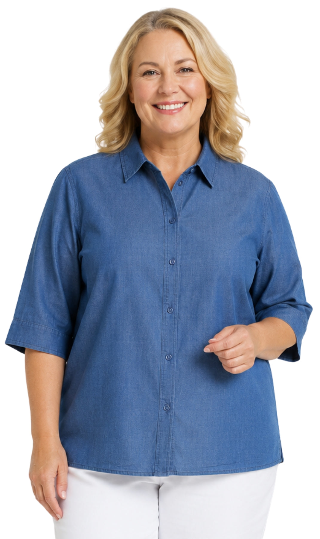 A smiling blonde woman wearing a blue button-front collared shirt with three-quarter sleeves and white pants, photographed against a plain white background.