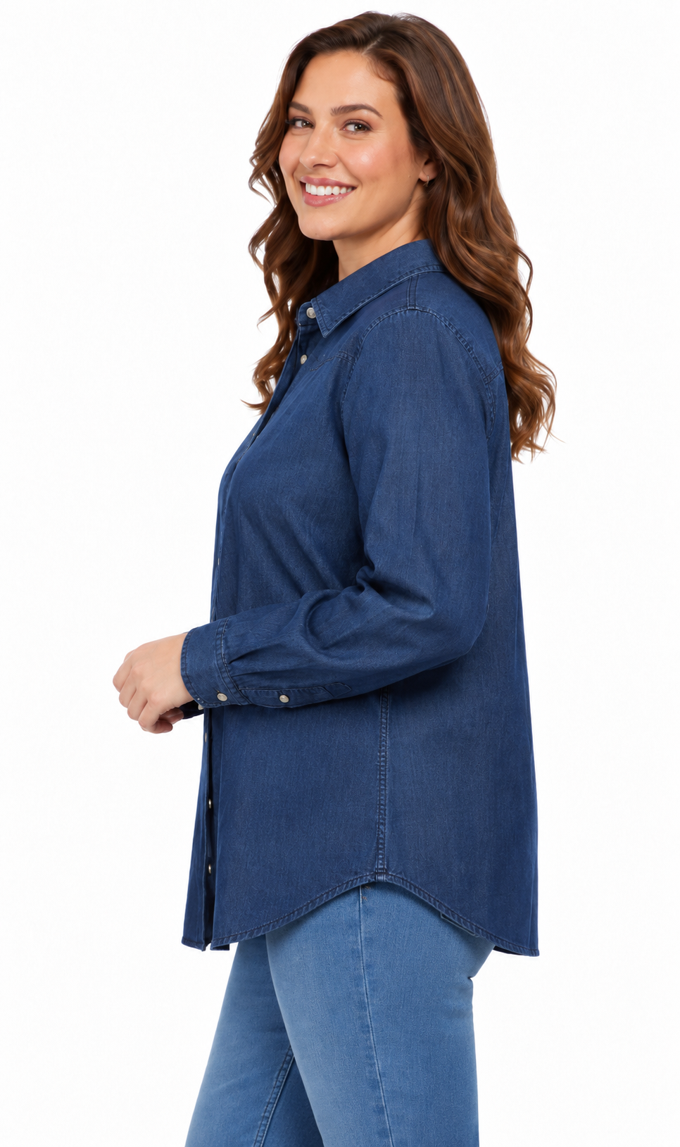 A woman wearing a blue denim button-up shirt and blue jeans, shown from a side profile against a plain white background.